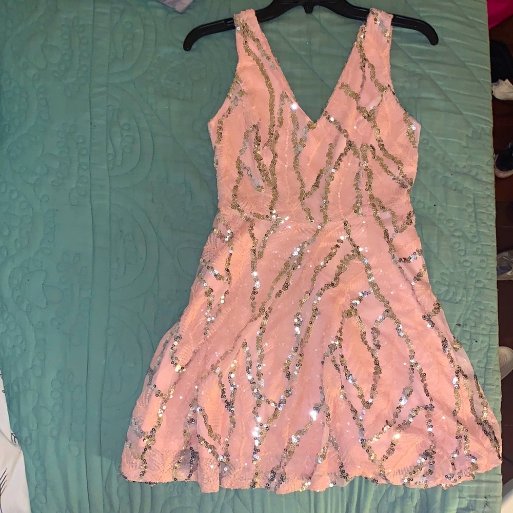A rose gold pink mini dress, size S. Only wore once.